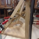 Petite croix croche dans un quart de cône, en pénétration dans un cylindre