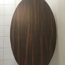 Table ovale piétement chêne dessus en stratifié ébène