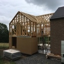 Ossature bois avec noue de charpente et ferme apparente