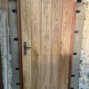 Porte d'entrée à parements de chêne