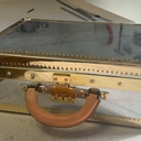 Une valise  en Bois , Zinc , cuir et laiton