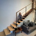 Escalier liment central bois/métal avec plateforme