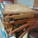 Boite carrée à 4 rangées de 4 tiroirs triangles pivotants