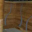 Rainure galbées en guise de poignées de porte.