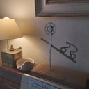 Cycliste dans l'effort , alliant métal et bois.  juin 2023