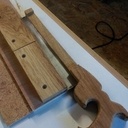 Une poignée pour scie a Dos