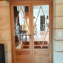 Porte double en chêne et faux linteau