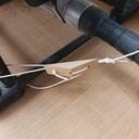 Tendeur de cordelette pour maintenir un tuyau d'aspirateur