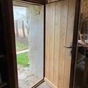 Porte d'entrée à parements de chêne