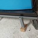 Support à roulette pour scie à ruban