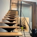 Escalier liment central bois/métal avec plateforme