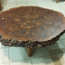 Table basse avec une galette en ormeau galeux