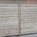 Dissimuler une pompe à chaleur et les poubelles