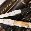 Couteaux pliants ressort intégré aux platines