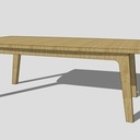 Une grande table en noyer tout en courbe