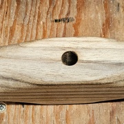 La poignée ou manivelle de la presse.