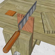 **1/** Nous descendons les joues des tenons et entailles.