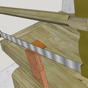 **a/** Amorce du sciage sur le bout de la pièce .