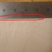 en rouge, preuve de l'imperfection de coupe