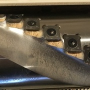 Encrassement de résine sur un arbre à plaquettes de raboteuse