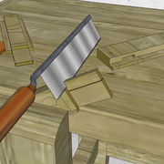 **4/** Nous taillons l'épaulement du tenon de la traverse basse.