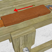 2/  la pièce à corroyer maintenue par les pointes contre la griffe par chocs au marteau