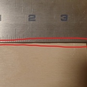 en rouge, preuve de l'imperfection de coupe