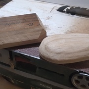 Forme à la ponceuse à bande