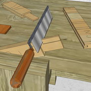 **3/** Apres avoir araser les tenons, nous traçons et scions l'épaulement et sa barbette de comblement sur le tenon de la traverse basse.