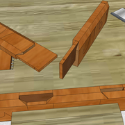 **6/** A l'aide de ciseaux à bois, nous entaillons précisément les ébarbements et onglets dans le montant.