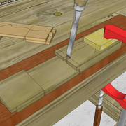 **8bis/** Nous entaillons les petits tenons et mortaises délicatement avec précision .