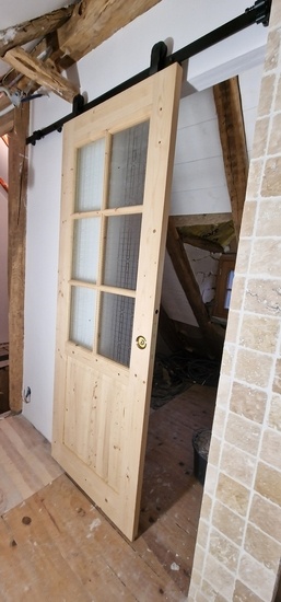 Porte coulissante en applique et habillage