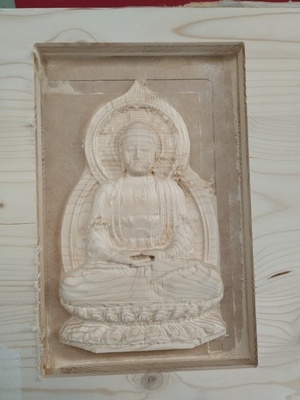 Réalisation d'un Bouddha en bois
