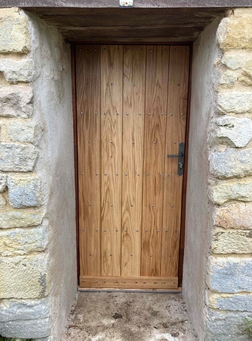 Porte d'entrée à parements de chêne