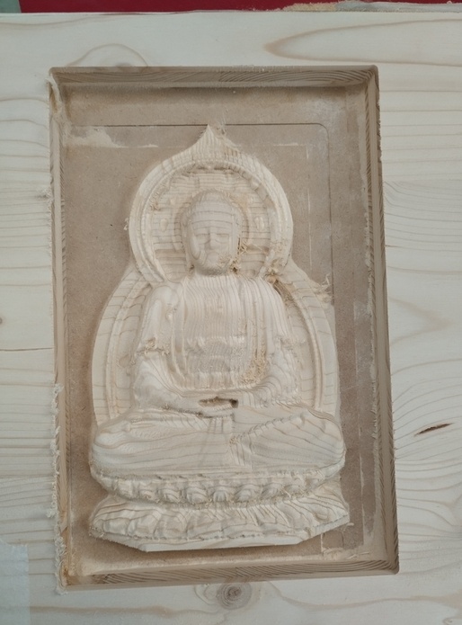 Réalisation d'un Bouddha en bois