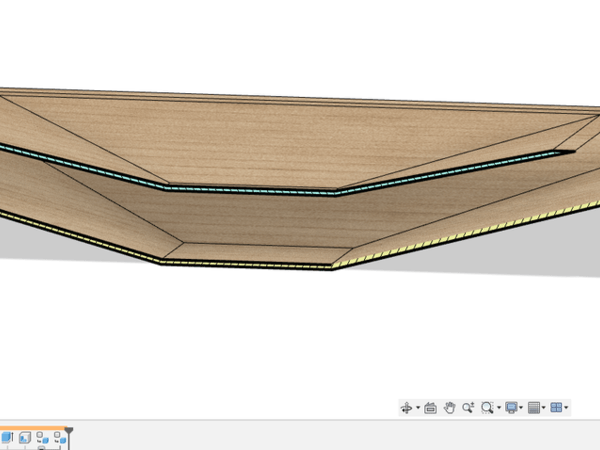 le corps hachuré vert est un solide creusé par la fonction coque depuis solide, le corps hachuré jaune est un corps solide créée avec épaissir à partir d'une Surface