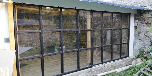 Double baie vitrée coulissante en bois