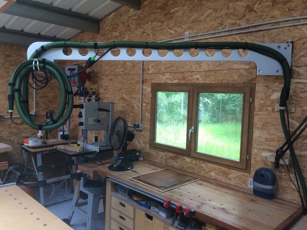 J'aspire à moins de poussière dans l'atelier.