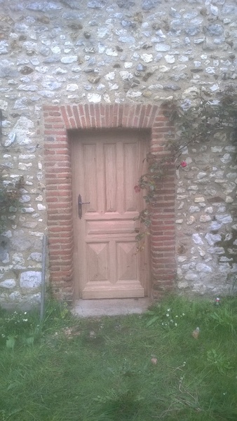 Porte a tas de sable à étanchéité renforcée
